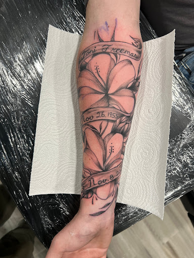 Explore daisy tattoo ideas, creative tattoo ideas in Conowingo, available at In Bloom Tattoo