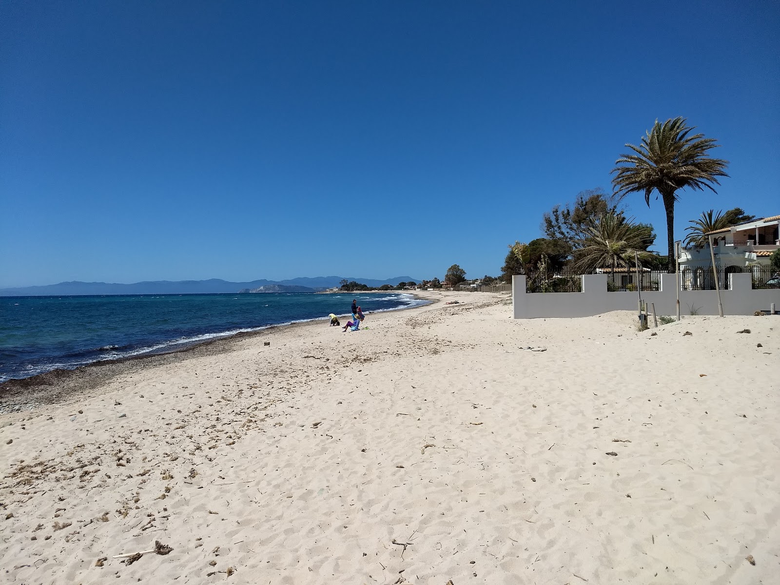 Fotografija Spiaggia Di Sant Andrea z svetel pesek površino