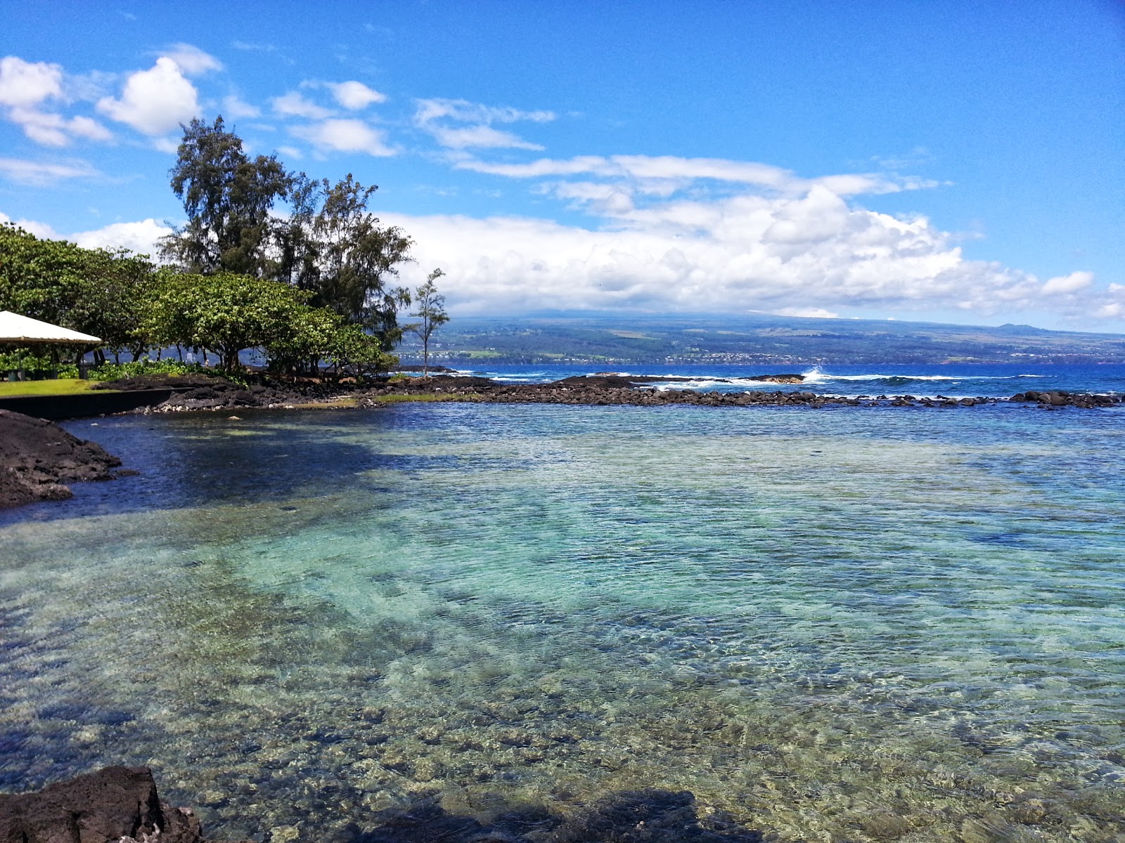 Photo of Onekahakaha Beach with turquoise pure water surface
