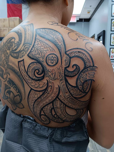 Explore tattoo back cover up ideas, creative tattoo ideas in El Paso, available at American Tattoo Society of Ft Bliss