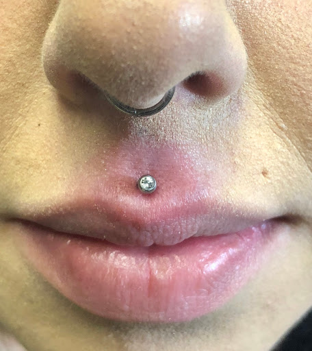 Explore cover up tattoo ideas for names on wrist, creative tattoo ideas in Bay Shore, available at Piercings By Dean 95