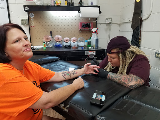 Explore kitty tattoo ideas, creative tattoo ideas in Cincinnati, available at UniquInk Tattoos & Piercings