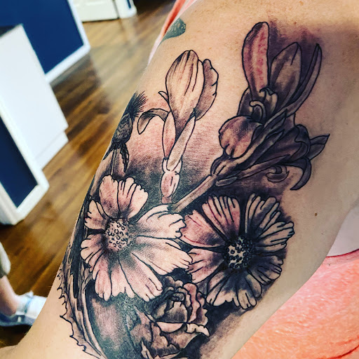 Explore dark sleeve tattoo ideas, creative tattoo ideas in Fort Oglethorpe, available at The Helm Tattoo & Piercing