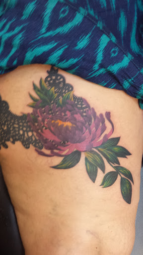 Explore womens neck tattoos ideas, creative tattoo ideas in Idaho Falls, available at Tat 208