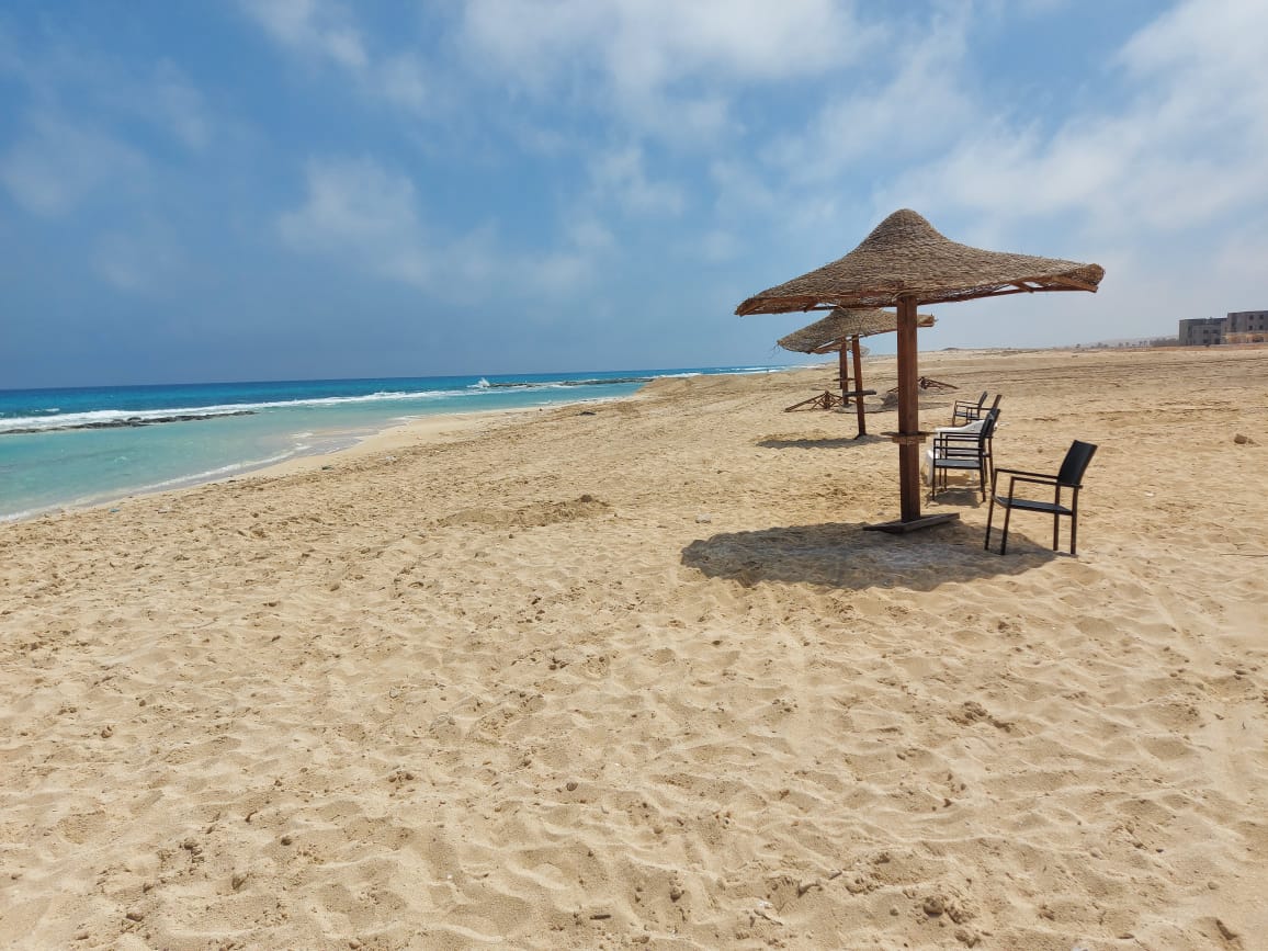 Foto von La Vista Bay mit feiner beiger sand Oberfläche