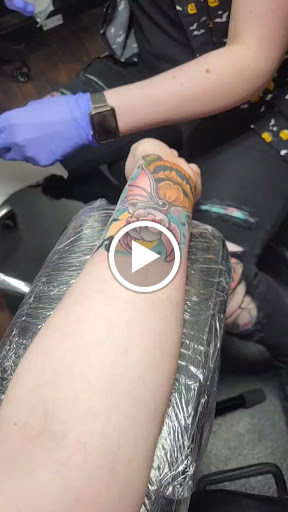 Explore women's arm sleeve tattoo ideas, creative tattoo ideas in Dubuque, available at The Crows Nest