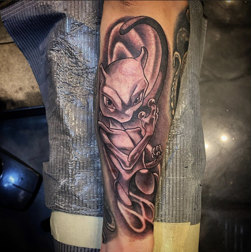Explore men's inner bicep tattoo ideas, creative tattoo ideas in Peoria, available at Modern Ink Tattoo