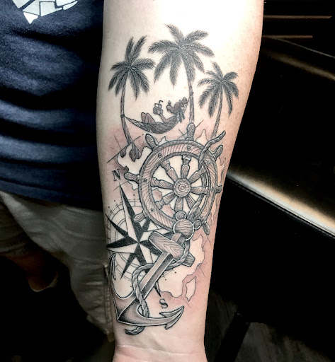 Explore american football tattoo ideas, creative tattoo ideas in Warrensburg, available at Altered Visions Tattoo Studio