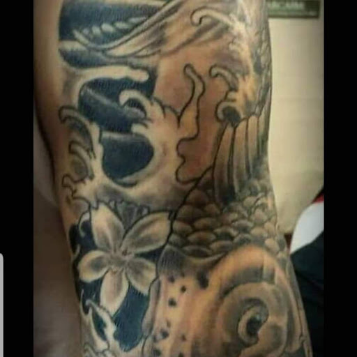 Explore mens collarbone tattoo ideas, creative tattoo ideas in Hudson Falls, available at ALTERED ADDICTION TATTOOS