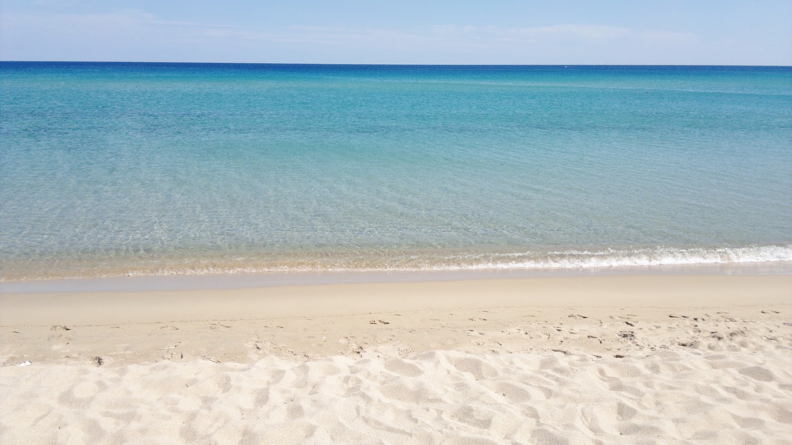 Foto av Spiaggia di S'Orologiu med lång rak strand