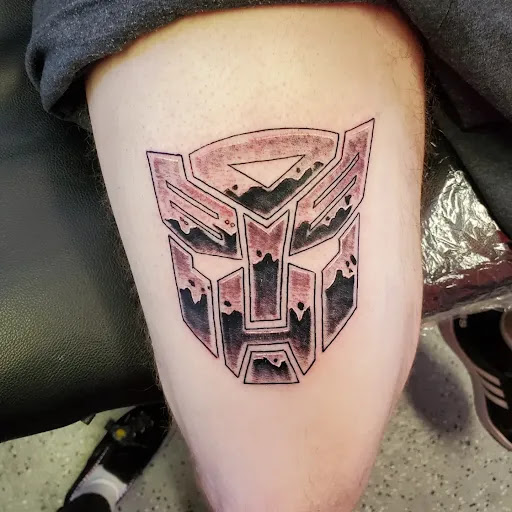 Explore olive branch tattoo ideas, creative tattoo ideas in Reno, available at Outlast Tattoo