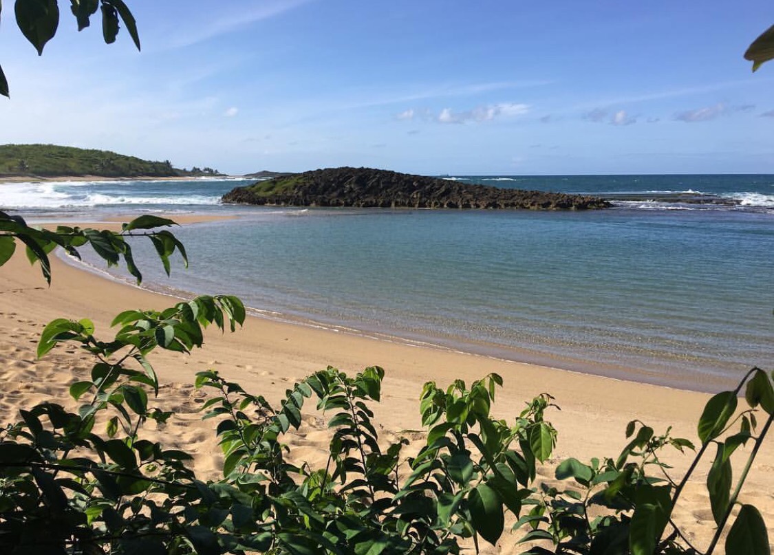 Photo of La Poza de las Mujeres with turquoise pure water surface