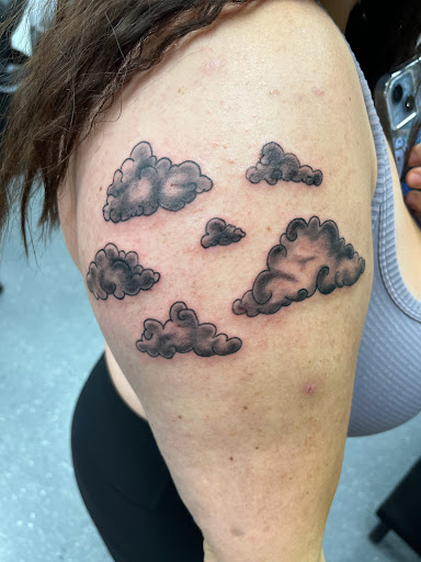 Explore women's leg tattoo ideas, creative tattoo ideas in La Vista, available at InkedUp Needles