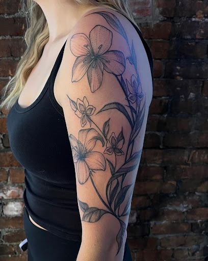 Explore shoulder tattoo ideas for females, creative tattoo ideas in Buffalo, available at True Gloom Tattoo Studio