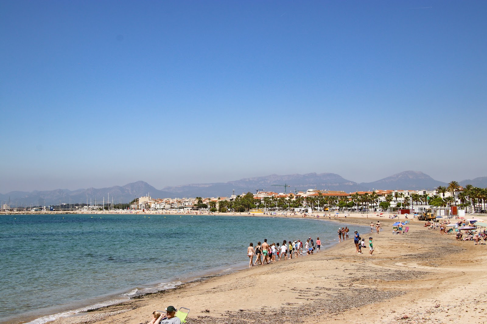 Fotografija Platja de la Llosa z svetel pesek površino