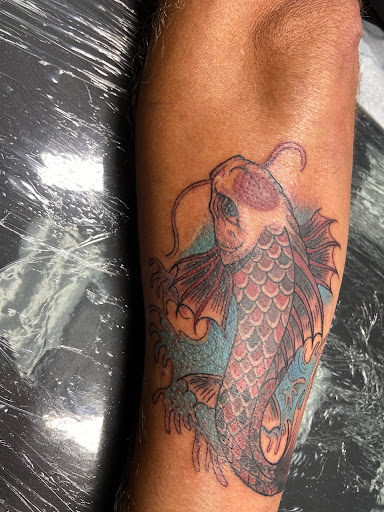 Explore fishing tattoo ideas for females, creative tattoo ideas in El Paso, available at American Tattoo Society of Ft Bliss