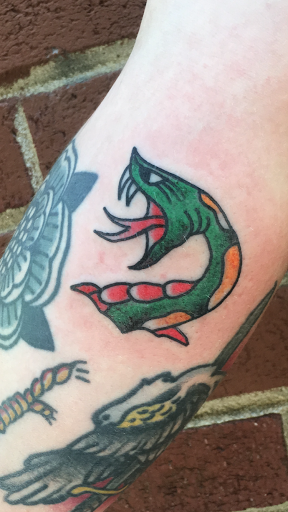 Explore sign language tattoo ideas, creative tattoo ideas in Atlanta, available at Big Cat Tattoo