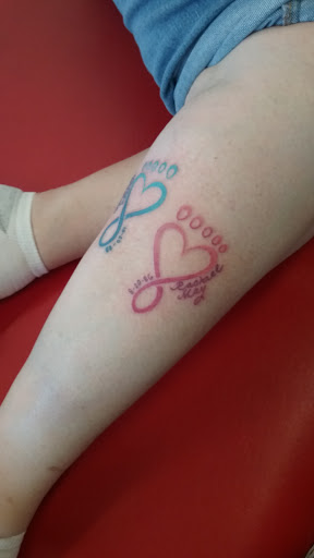 Explore small red tattoos ideas, creative tattoo ideas in Milwaukee, available at Atomic Tattoos