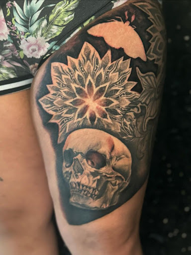Explore small dinosaur tattoo ideas, creative tattoo ideas in Houston, available at 333 Tattoo Studio HTX