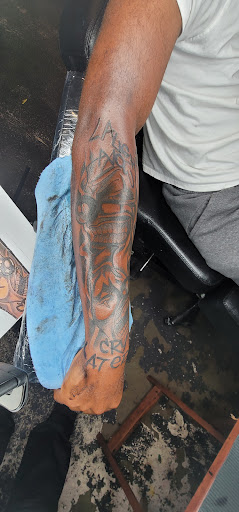 Explore barbell tattoo ideas, creative tattoo ideas in Jacksonville, available at Renegade Art Studio LLC