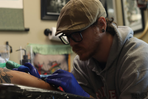 Explore olive tattoo ideas, creative tattoo ideas in Nashville, available at RedBird Tattoo