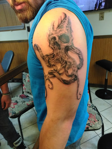 Explore tattoo ideas for men leg, creative tattoo ideas in Johnstown, available at Screaming Needle Tattoo & Body Piercing