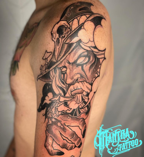Explore tattoo ideas for men inner bicep, creative tattoo ideas in Denver, available at Mantra Tattoo and Piercing