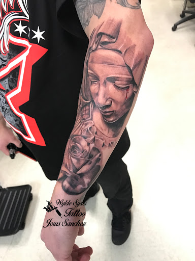 Find charm bracelet tattoo ideas for your next unique tattoo in San Diego at Wylde Sydes Tattoo & Body Piercing