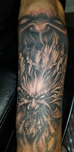 Find small wolf tattoo ideas for your next unique tattoo in Angola at Hoodlum Ink