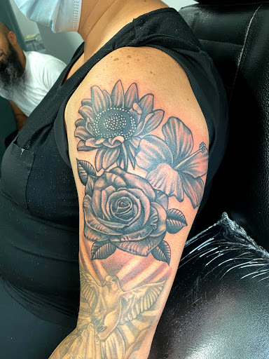 Explore rose foot tattoo ideas, creative tattoo ideas in Passaic, available at District 36 Tattoo Parlor