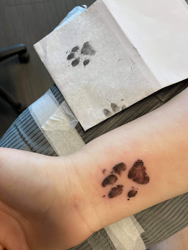 Explore kiss tattoo ideas, creative tattoo ideas in Palm Harbor, available at Angry Owl Tattoo and Piercing