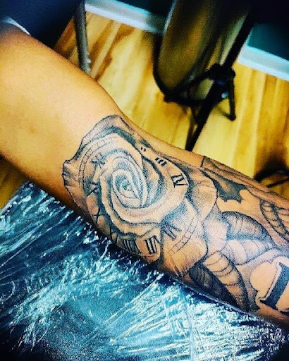 Explore rose hand tattoo ideas, creative tattoo ideas in Homosassa, available at Citrus Tattoos