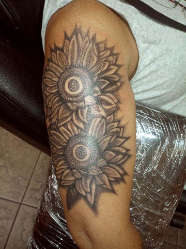 Explore memorial tattoo ideas for guys, creative tattoo ideas in Okeechobee, available at Muck City Tattoos & Piercings