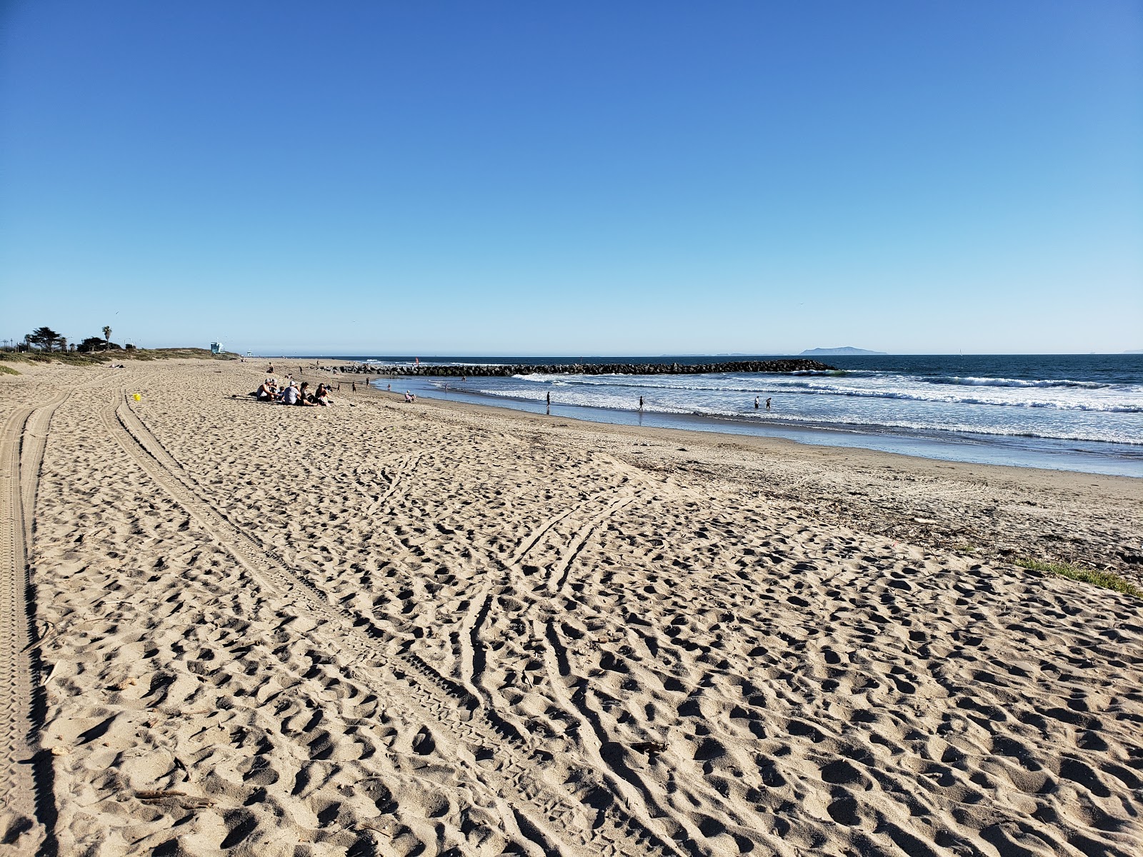 Foto von Harbor Cove Beach mit beiger sand Oberfläche
