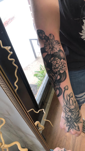 Explore dirt bike tattoos ideas, creative tattoo ideas in Muncie, available at Fox & Sparrow Tattoo