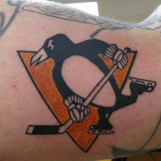 Explore triskelion tattoo ideas, creative tattoo ideas in Marietta, available at Monkeys Uncle Tattoo