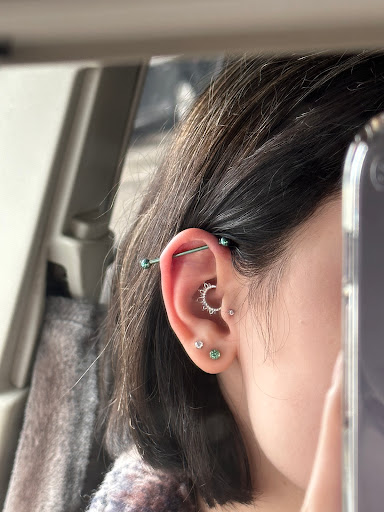 Explore female neck tattoo ideas, creative tattoo ideas in Toledo, available at Piercings by Caitlin presents Holier Toledo