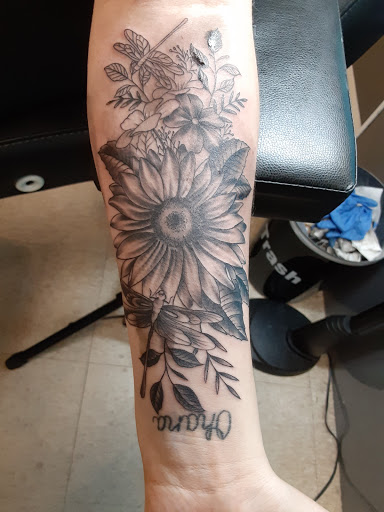 Explore cupid tattoo ideas, creative tattoo ideas in Eden, available at Slicks Tattoo Studio