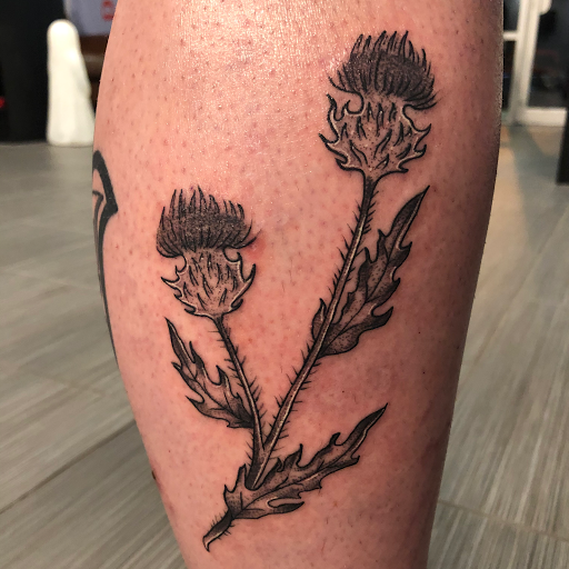 Explore lower sleeve tattoo ideas, creative tattoo ideas in Palm Harbor, available at Angry Owl Tattoo and Piercing