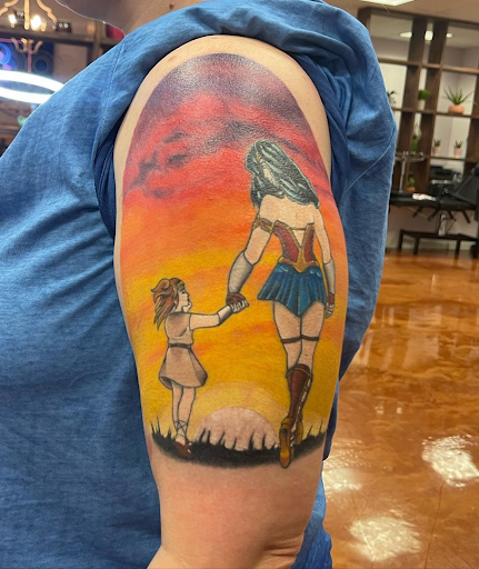Explore dragon tattoo ideas for guys, creative tattoo ideas in Aledo, available at Elevated Tattoo & Piercing