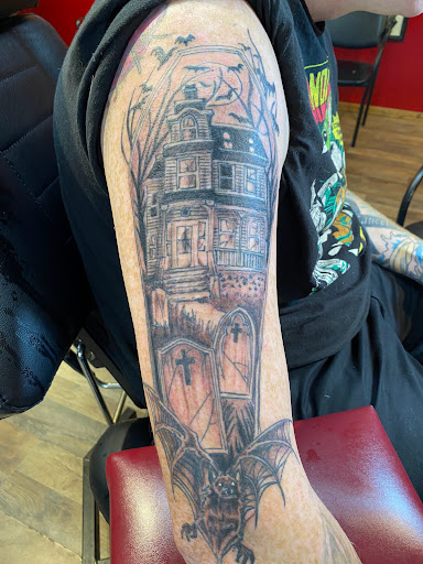 Explore lotus tattoo ideas, creative tattoo ideas in Pikeville, available at The Carbon Canary Tattoo Studio