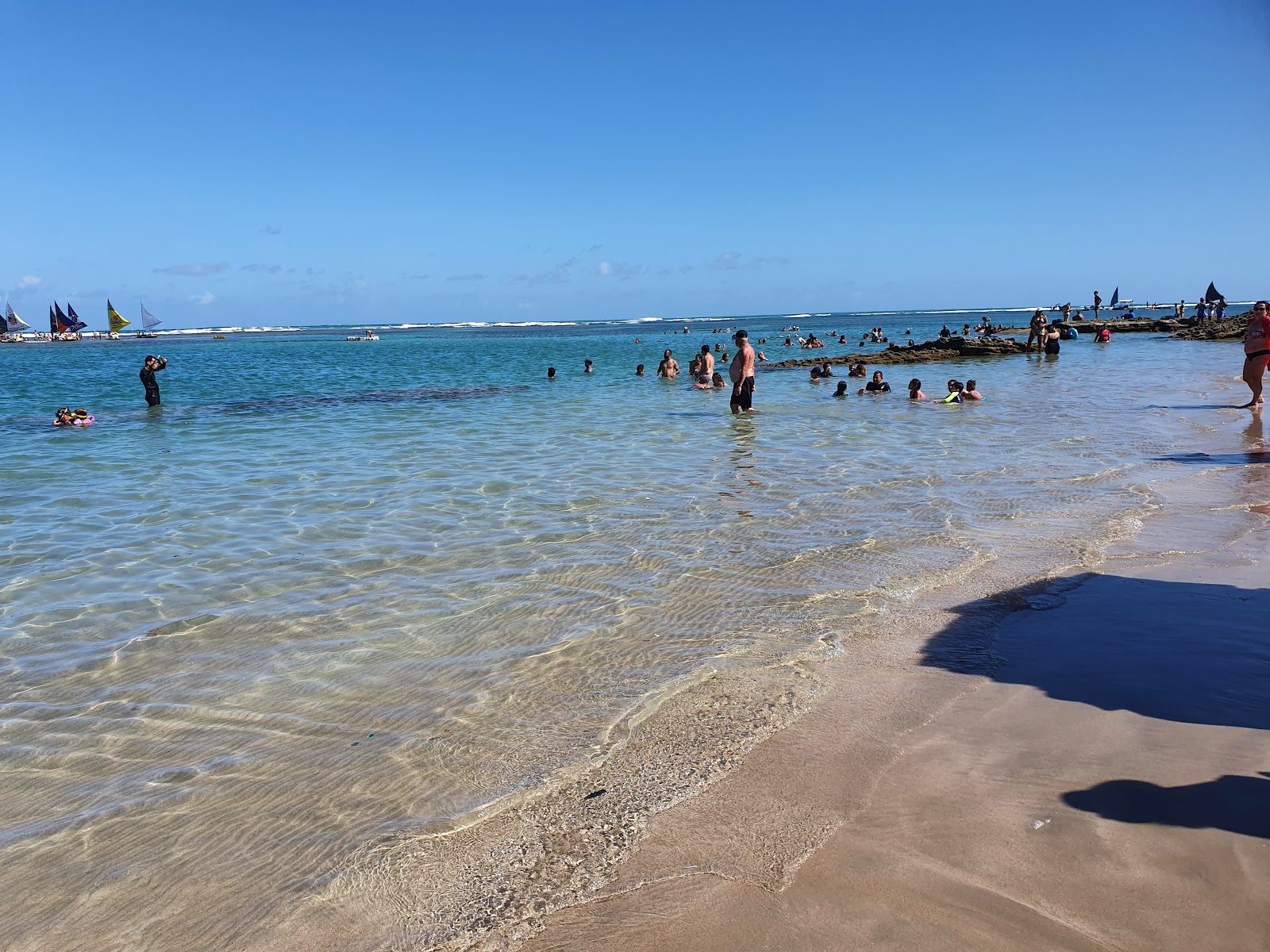 Fotografie cu Plaja Porto de Galinhas cu o suprafață de apa pură turcoaz