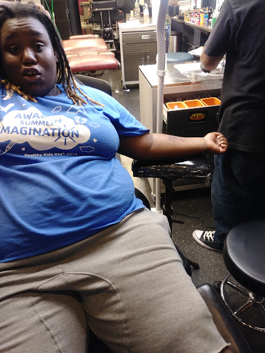 Explore daughter and son tattoo ideas, creative tattoo ideas in Trenton, available at Kiss of Ink Tattoo