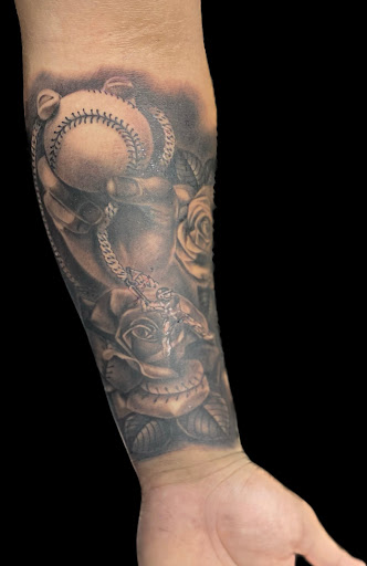 Explore arm cross tattoo ideas, creative tattoo ideas in Weatherford, available at Weatherford Tattoo Co.