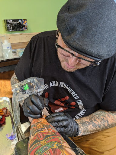 Find best full sleeve tattoo ideas for your next unique tattoo in Powell at Hummingbird Tattoo Studio