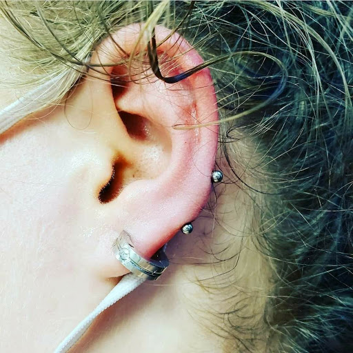 Explore skull and roses tattoo ideas, creative tattoo ideas in North Charleston, available at Exotic Impressions Body Piercing