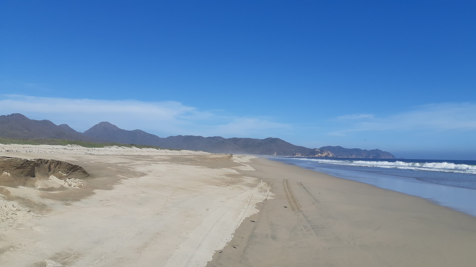 Foto di Playa Pena Blanca con una superficie del sabbia marrone