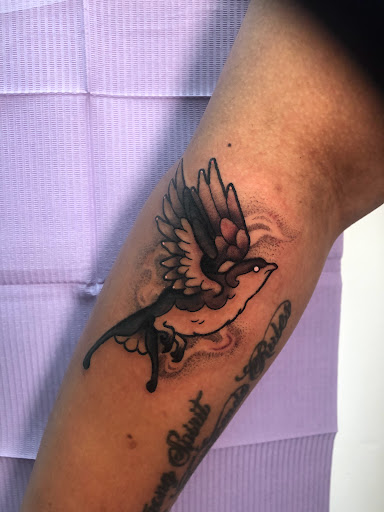 Explore grieving tattoo ideas, creative tattoo ideas in Adrian, available at Ambition Ink