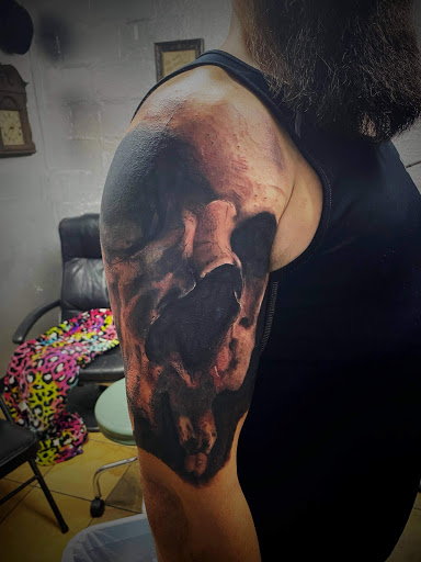 Explore black and grey sleeve tattoo ideas, creative tattoo ideas in Valdosta, available at Acid Ink Tattoos