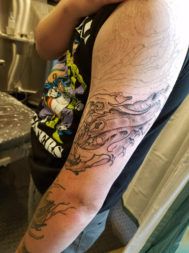 Explore cross forearm tattoo ideas, creative tattoo ideas in Salt Lake City, available at Big Deluxe Tattoo